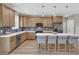 Modern kitchen featuring an island with seating, stainless steel appliances, and ample counter space at 9342 Turkey Way, Middlesex, NC 27557