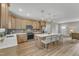Bright kitchen with island seating, wood cabinets, stainless steel appliances, and an open-concept design at 9342 Turkey Way, Middlesex, NC 27557