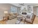 Cozy living room with fireplace, built-in shelves, and natural light at 9342 Turkey Way, Middlesex, NC 27557