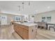 Open concept layout with kitchen island, dining area, and living space, perfect for entertaining at 9342 Turkey Way, Middlesex, NC 27557