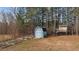 Spacious backyard with shed, playset, and patio at 100 Churchill Rd, Louisburg, NC 27549