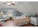 Charming bedroom with vaulted ceilings, ceiling fan, and decor at 100 Churchill Rd, Louisburg, NC 27549