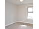 The bright bedroom features a cozy carpet and a window for natural light at 100 Churchill Rd, Louisburg, NC 27549
