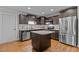 Beautiful kitchen featuring granite countertops, stainless steel appliances, and a kitchen island at 100 Churchill Rd, Louisburg, NC 27549