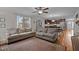 Spacious living room with hardwood floors, sofas and a view of the kitchen area at 100 Churchill Rd, Louisburg, NC 27549