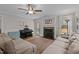 Comfortable living room with hardwood floors, fireplace, and a piano at 100 Churchill Rd, Louisburg, NC 27549