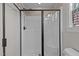 This bathroom features a sleek walk-in shower with glass doors and a tiled shower at 100 Churchill Rd, Louisburg, NC 27549