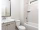 Bright bathroom with white subway tiles, modern fixtures, and a marble countertop vanity, offering a spa-like experience at 116 Bearwallow Forest Way, Wendell, NC 27591