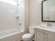 Bathroom featuring a vanity, toilet, and bathtub with tile surround at 116 Bearwallow Forest Way, Wendell, NC 27591