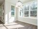 Cozy breakfast nook with lots of windows offering views of trees and sunlight at 116 Bearwallow Forest Way, Wendell, NC 27591