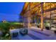 Outdoor seating area of a community clubhouse at dusk at 116 Bearwallow Forest Way, Wendell, NC 27591