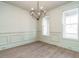 Bright dining area featuring wood floors, custom molding and large windows at 116 Bearwallow Forest Way, Wendell, NC 27591