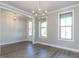 Formal dining room with hardwood floors and a chandelier at 116 Bearwallow Forest Way, Wendell, NC 27591