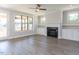 Spacious living room with hardwood floors, fireplace, built-in cabinets, and doors leading to balcony at 116 Bearwallow Forest Way, Wendell, NC 27591