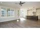 Bright living area adjoining an island kitchen and a screened-in porch at 116 Bearwallow Forest Way, Wendell, NC 27591