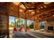 Wood framed outdoor pavilion with stone fireplace, ceiling fan and views of the lake at 116 Bearwallow Forest Way, Wendell, NC 27591