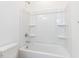 Bathroom features a white shower and tub combination at 121 Big Bradley Way, Wendell, NC 27591