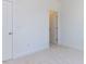 Bedroom with neutral carpet, white trim and walls and an open door at 121 Big Bradley Way, Wendell, NC 27591