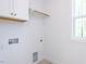 Laundry room has washer hookups and a cabinet at 121 Big Bradley Way, Wendell, NC 27591