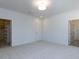 Neutral bedroom showcasing plush carpeting, recessed lighting, walk-in closet, and entrance to ensuite bath at 121 Big Bradley Way, Wendell, NC 27591