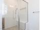 Modern bathroom featuring a frameless glass shower with subway tile, built-in bench, and showerhead at 121 Big Bradley Way, Wendell, NC 27591