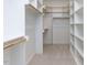 Large walk-in closet featuring custom shelving and hanging rods for ample storage space at 121 Big Bradley Way, Wendell, NC 27591