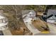 Aerial view of a two-story home with mature trees and manicured lawn at 1305 Turks Head Ct, Zebulon, NC 27597