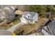 Aerial view of a two-story home with mature trees and manicured lawn at 1305 Turks Head Ct, Zebulon, NC 27597