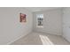 Cozy bedroom featuring a window for natural light and soft carpeting at 1305 Turks Head Ct, Zebulon, NC 27597