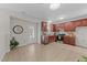 Open kitchen featuring wooden cabinetry, stainless steel appliances, and a connecting view to the exterior at 1305 Turks Head Ct, Zebulon, NC 27597