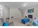 Bright living room with a fireplace, a comfortable seating arrangement, and open access to the staircase at 1305 Turks Head Ct, Zebulon, NC 27597