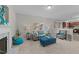 Bright living room with a fireplace, cozy seating, and an open view to the kitchen at 1305 Turks Head Ct, Zebulon, NC 27597