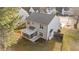 This exterior shot showcases a house with a screened-in porch and a fenced-in backyard at 1305 Turks Head Ct, Zebulon, NC 27597