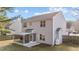 The rear exterior of the house shows the screened-in porch and fenced-in backyard on a sunny day at 1305 Turks Head Ct, Zebulon, NC 27597