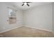 Cozy bedroom with ceiling fan and neutral carpeting at 131 Kinnakeet Dr, Durham, NC 27704