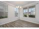 Bright dining area with wood-look floors and multiple windows at 131 Kinnakeet Dr, Durham, NC 27704
