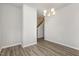 Bright dining room features hardwood floors and a modern chandelier at 131 Kinnakeet Dr, Durham, NC 27704