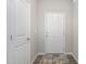 Bright entryway with white doors and wood-look flooring at 131 Kinnakeet Dr, Durham, NC 27704