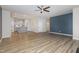 Open living room with a view into the kitchen and a fireplace at 131 Kinnakeet Dr, Durham, NC 27704