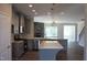 Modern kitchen with gray cabinets, granite countertops, and an island at 1334 Reading Ct # 48Kl, Burlington, NC 27217