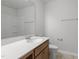 Neutral bathroom features a vanity, toilet, and a shower-tub combo in a clean and modern design at 139 Grove Township Way, Angier, NC 27501