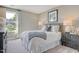 Comfortable bedroom with a queen-size bed and wood nightstand at 139 Grove Township Way, Angier, NC 27501