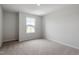 Bedroom with neutral carpet, a single window, and plenty of natural light at 139 Grove Township Way, Angier, NC 27501