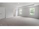 This spacious bedroom has neutral carpet and a tray ceiling for added elegance at 139 Grove Township Way, Angier, NC 27501