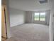 Expansive bedroom featuring a neutral palette, plush carpeting, and abundant natural light at 139 Grove Township Way, Angier, NC 27501