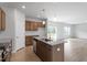 Modern kitchen featuring an island with granite countertops, stainless steel appliances, and pendant lighting at 139 Grove Township Way, Angier, NC 27501