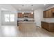 Spacious kitchen with granite countertops, stainless steel appliances, and an island with pendant lighting at 139 Grove Township Way, Angier, NC 27501