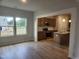 Inviting living room showcasing abundant natural light and an open concept to the kitchen at 139 Grove Township Way, Angier, NC 27501