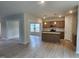 Bright and airy living space adjacent to a modern kitchen with a center island at 139 Grove Township Way, Angier, NC 27501