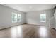 Bright living room with many windows and neutral wall color provides great natural light at 139 Grove Township Way, Angier, NC 27501